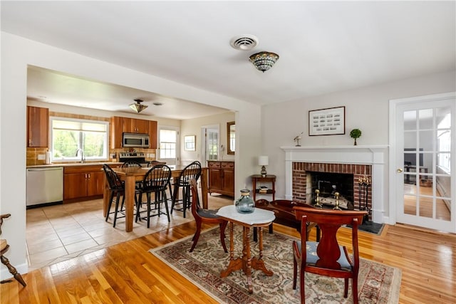 103 Carrs Pond Rd, West Greenwich, RI 02817 - living room featuring a fireplace and light wood finished floors