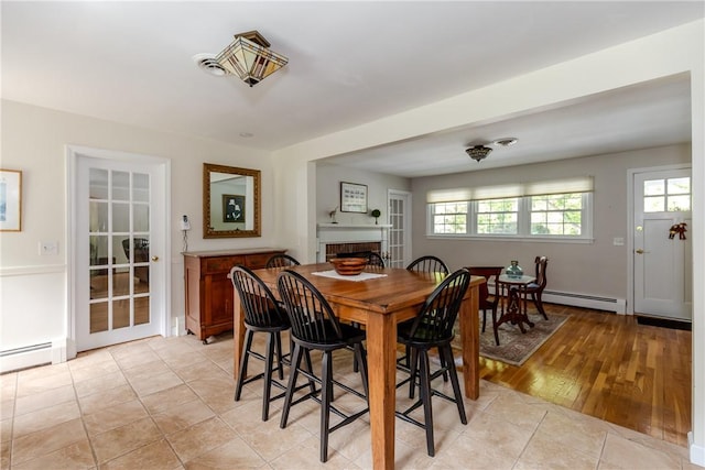 103 Carrs Pond Rd, West Greenwich, RI 02817 - dining space featuring baseboard heating and a fireplace