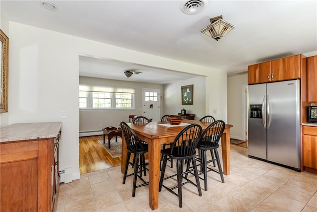 103 Carrs Pond Rd, West Greenwich, RI 02817 - dining room with a baseboard heating unit, baseboard heating, and light tile patterned flooring