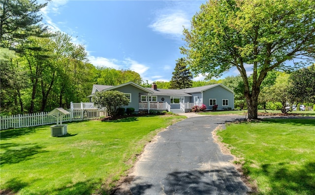 103 Carrs Pond Rd, West Greenwich, RI 02817 - ranch-style home with covered porch, a chimney, and asphalt driveway
