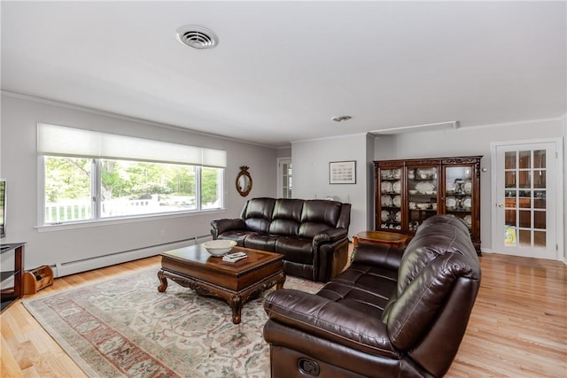 103 Carrs Pond Rd, West Greenwich, RI 02817 - living room with baseboard heating, ornamental molding, and wood finished floors