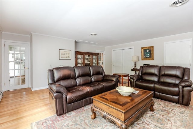 103 Carrs Pond Rd, West Greenwich, RI 02817 - living area with light wood-type flooring, ornamental molding, and baseboards