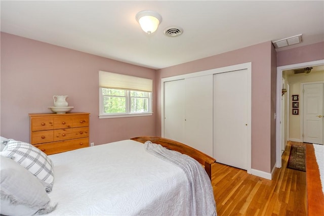 103 Carrs Pond Rd, West Greenwich, RI 02817 - bedroom with light wood-style flooring, a closet, and baseboards