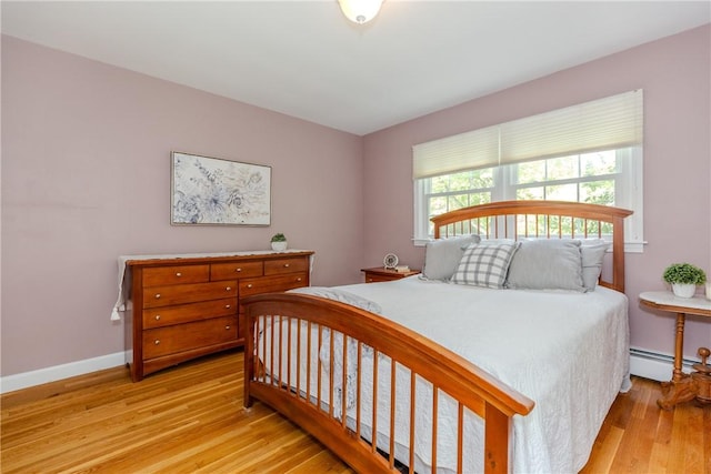 103 Carrs Pond Rd, West Greenwich, RI 02817 - bedroom featuring light wood finished floors, a baseboard radiator, and baseboards