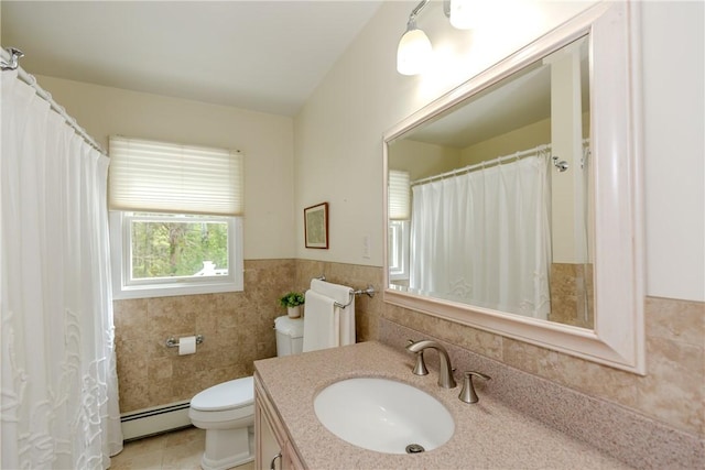 103 Carrs Pond Rd, West Greenwich, RI 02817 - full bathroom featuring a baseboard heating unit, tile walls, vanity, toilet, and wainscoting