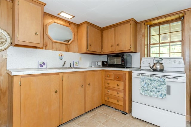103 Carrs Pond Rd, West Greenwich, RI 02817 - kitchen with white electric range, a sink, light countertops, light tile patterned floors, and stainless steel microwave