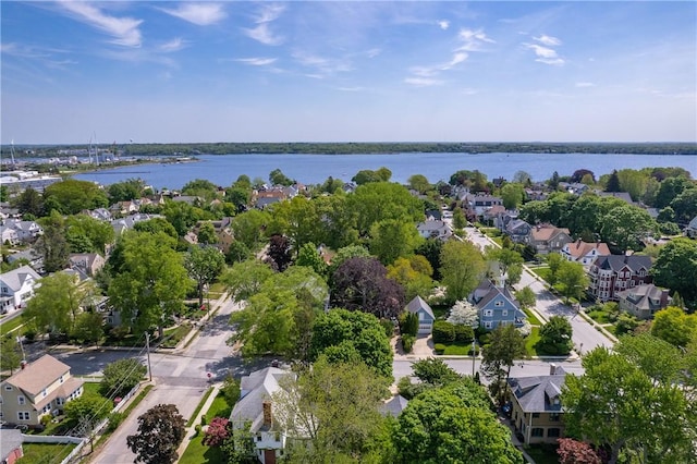 aerial view of residential area with a large body of water