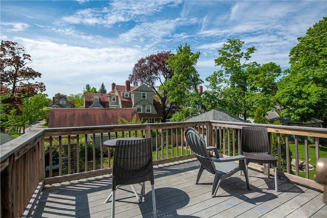 wooden deck featuring a residential view