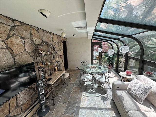 sunroom / solarium with outdoor dining area