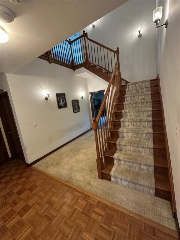 stairway featuring baseboards