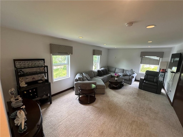 living area with carpet floors, recessed lighting, and baseboards