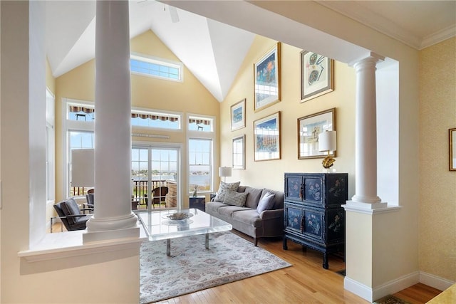 43 Waters Edge, Tiverton, RI 02878 - living room featuring decorative columns, wood finished floors, healthy amount of natural light, lofted ceiling, and crown molding