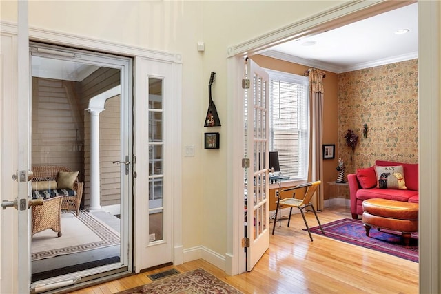 43 Waters Edge, Tiverton, RI 02878 - entryway with light wood-type flooring, french doors, baseboards, ornamental molding, and wallpapered walls