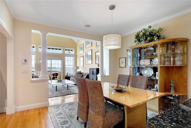 43 Waters Edge, Tiverton, RI 02878 - dining room featuring decorative columns, light wood-type flooring, baseboards, and crown molding