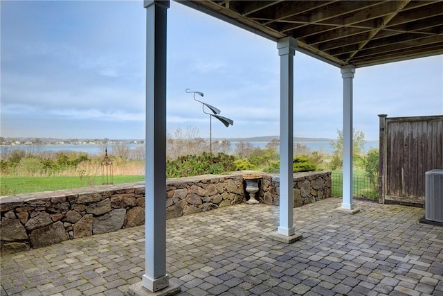 43 Waters Edge, Tiverton, RI 02878 - view of patio featuring cooling unit, a water view, and fence