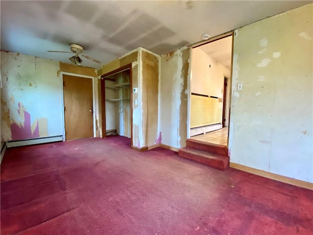 unfurnished bedroom with baseboard heating, carpet, a closet, and a baseboard radiator