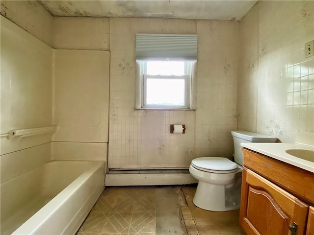 bathroom with a baseboard radiator, toilet, vanity, a bath, and a shower