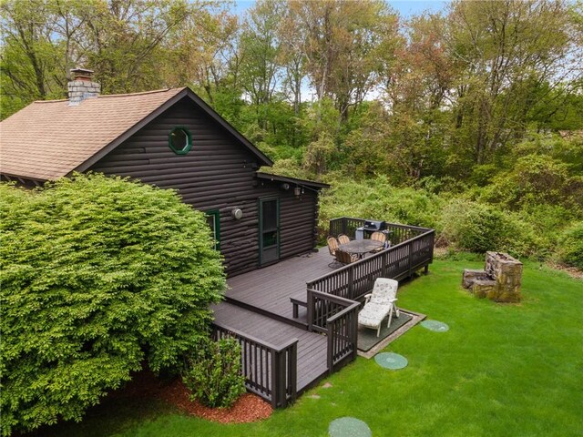 4 Ottawa Trl, Narragansett, RI 02882 - rear view of house with a lawn, a deck, and a chimney