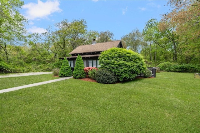 4 Ottawa Trl, Narragansett, RI 02882 - view of side of home featuring a yard and a chimney