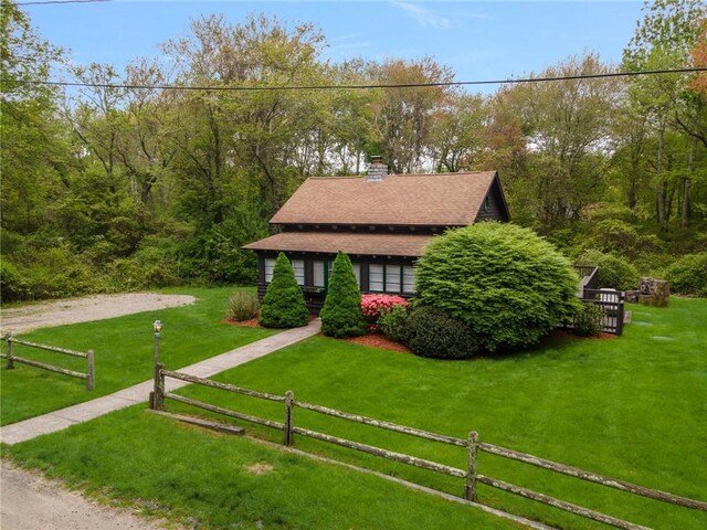 4 Ottawa Trl, Narragansett, RI 02882 - view of front facade featuring a chimney and a shingled roof