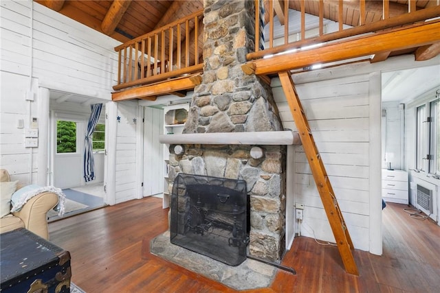 4 Ottawa Trl, Narragansett, RI 02882 - living area with hardwood / wood-style flooring, wooden ceiling, wood walls, and a stone fireplace