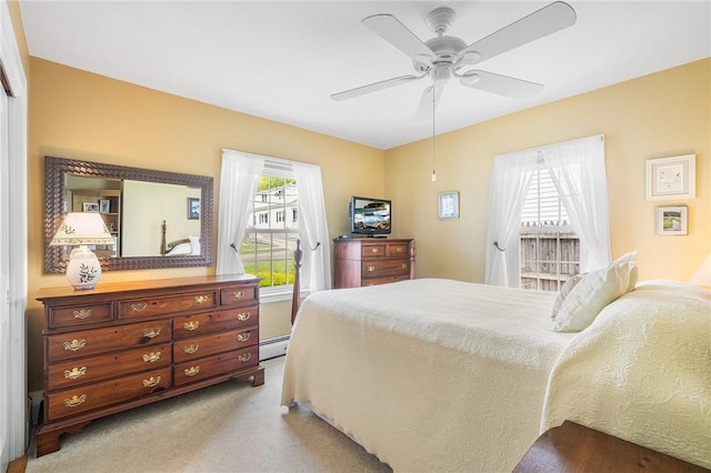 146 Bay View Ave, Bristol, RI 02809 - bedroom featuring baseboard heating, light carpet, and ceiling fan