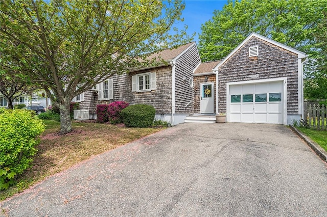 146 Bay View Ave, Bristol, RI 02809 - view of front facade with an attached garage and driveway