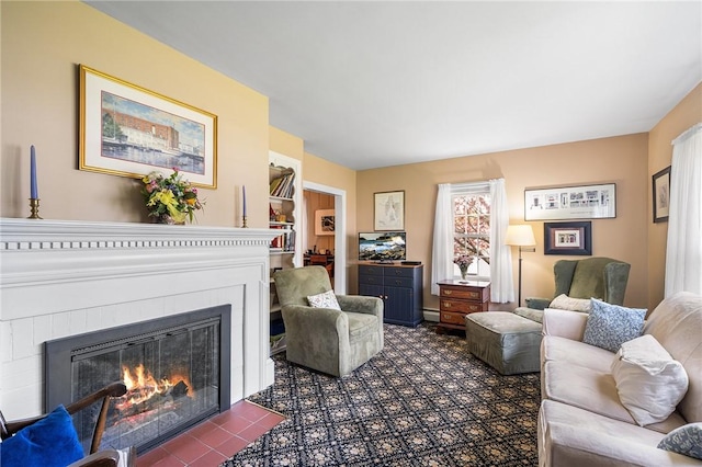 146 Bay View Ave, Bristol, RI 02809 - living area with a glass covered fireplace and a baseboard heating unit