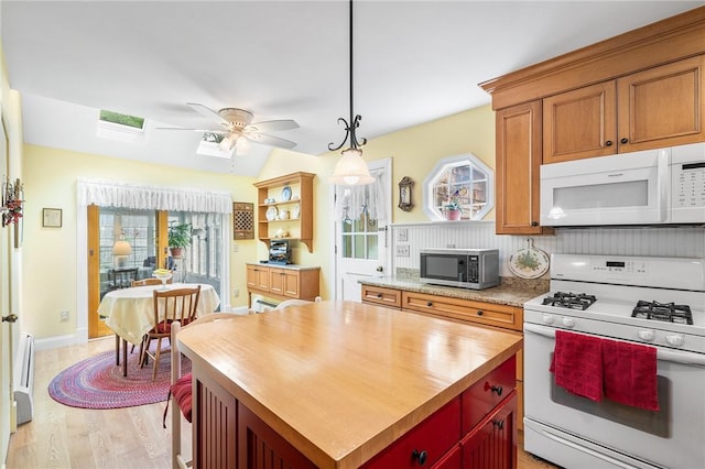 146 Bay View Ave, Bristol, RI 02809 - kitchen with white appliances, a ceiling fan, light wood finished floors, open shelves, and hanging light fixtures