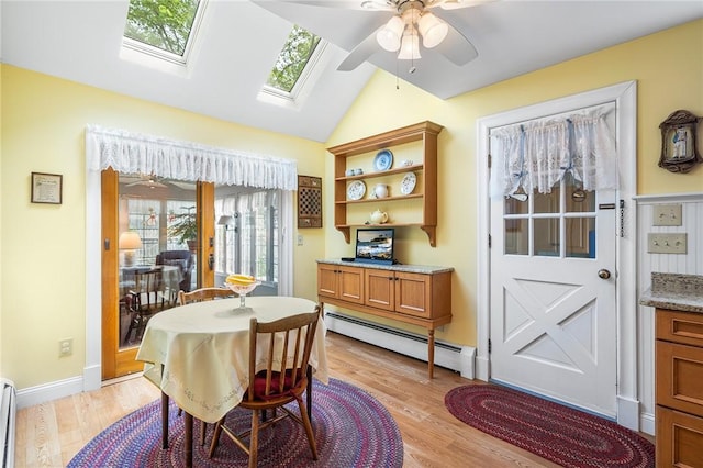 146 Bay View Ave, Bristol, RI 02809 - dining space with a baseboard heating unit, light wood-style flooring, lofted ceiling, a ceiling fan, and a baseboard radiator