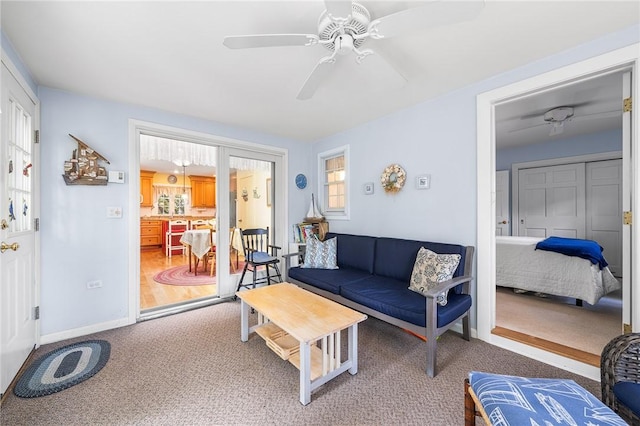 146 Bay View Ave, Bristol, RI 02809 - living area featuring a ceiling fan, light colored carpet, and baseboards