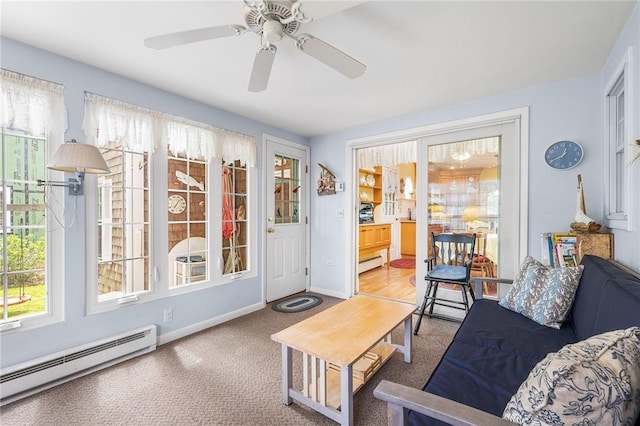 146 Bay View Ave, Bristol, RI 02809 - living room featuring baseboard heating, carpet, baseboards, and ceiling fan