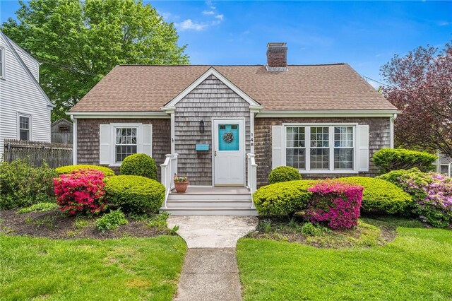 146 Bay View Ave, Bristol, RI 02809 - view of front of property featuring a chimney and a shingled roof
