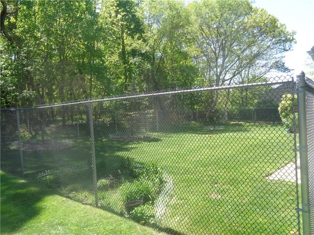 view of yard with a tennis court
