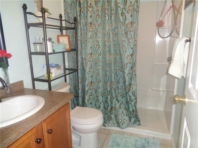 bathroom with a shower with shower curtain, tile patterned flooring, vanity, and toilet
