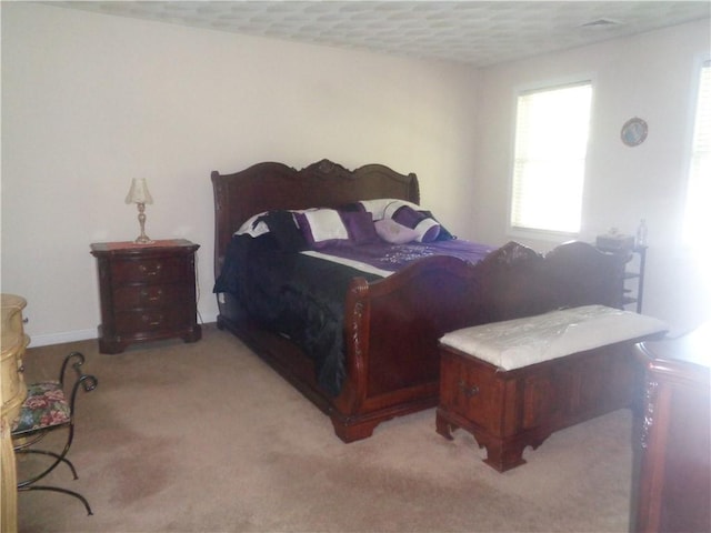bedroom with light carpet