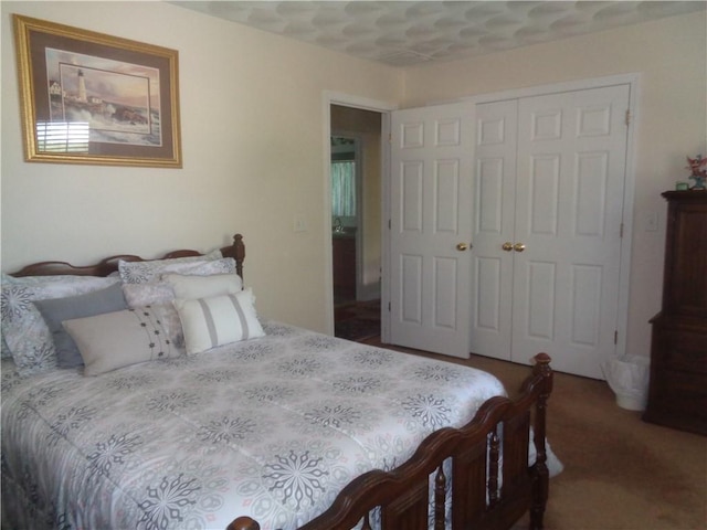 carpeted bedroom with a closet