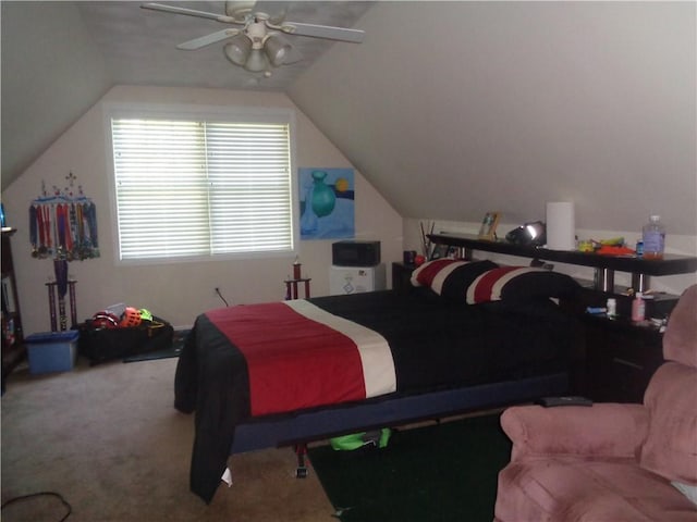 bedroom featuring carpet floors, vaulted ceiling, and a ceiling fan