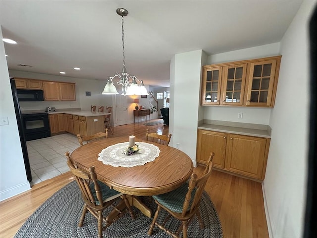19 Calabria Ct Unit 19, Westerly, RI 02891 - dining area featuring light wood-type flooring, a chandelier, recessed lighting, and baseboards