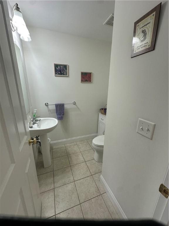 19 Calabria Ct Unit 19, Westerly, RI 02891 - bathroom with tile patterned floors, toilet, and baseboards