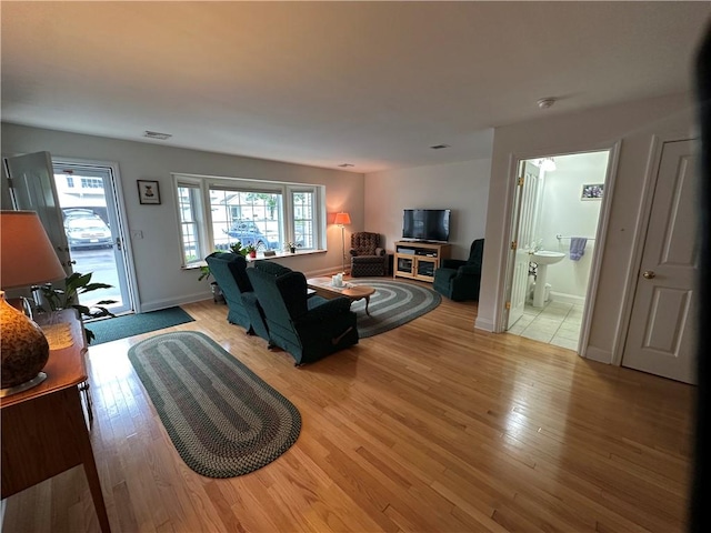 19 Calabria Ct Unit 19, Westerly, RI 02891 - living room featuring light wood-type flooring and baseboards