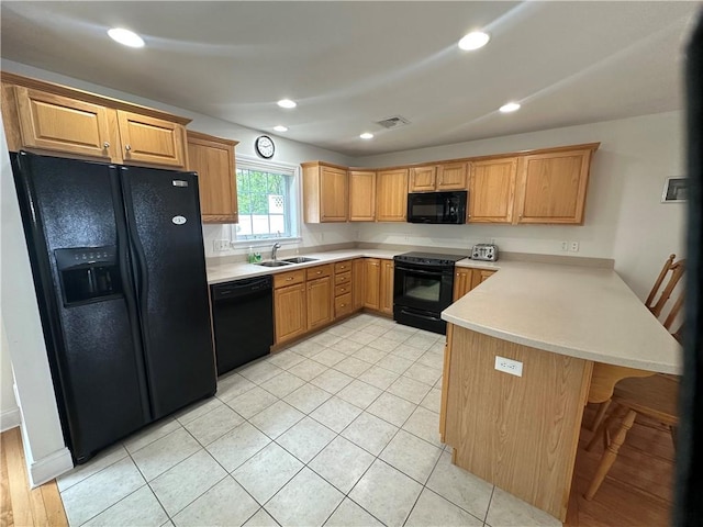19 Calabria Ct Unit 19, Westerly, RI 02891 - kitchen with black appliances, a sink, a peninsula, light countertops, and recessed lighting