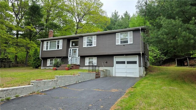 22 Winsor Ave, Johnston, RI 02919 - raised ranch featuring an attached garage, a chimney, asphalt driveway, and a front lawn