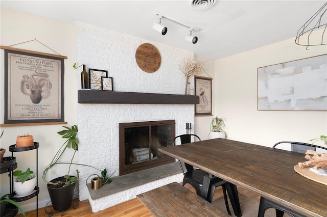 37 Charles St, Barrington, RI 02806 - dining room with a fireplace and wood finished floors