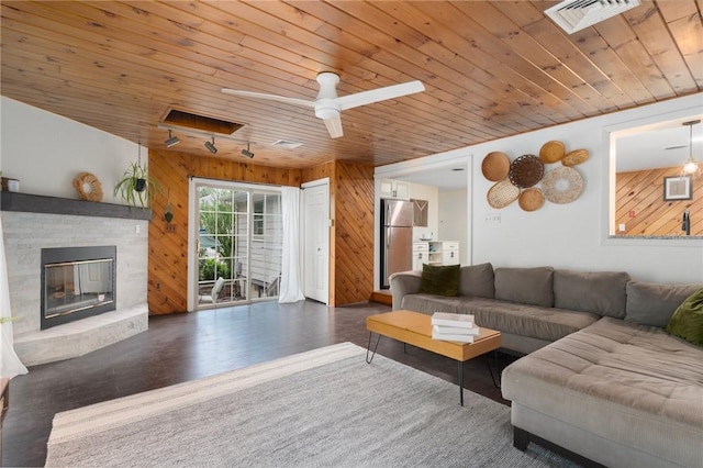 37 Charles St, Barrington, RI 02806 - living room featuring wooden walls, wooden ceiling, a fireplace, wood finished floors, and a ceiling fan