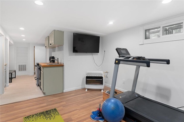 37 Charles St, Barrington, RI 02806 - exercise area featuring heating unit, light wood-style floors, recessed lighting, and baseboards