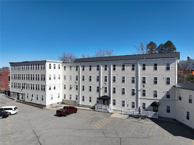view of property with uncovered parking