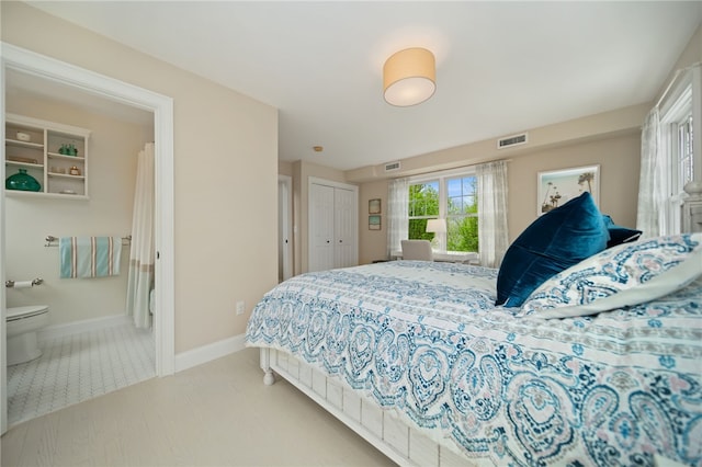 9 Casey Ct, Newport, RI 02840 - bedroom featuring connected bathroom, baseboards, and a closet