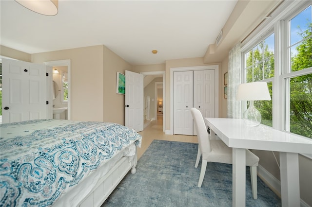 9 Casey Ct, Newport, RI 02840 - bedroom featuring a closet, light wood-style flooring, ensuite bathroom, and baseboards