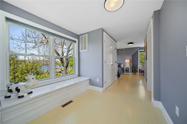 9 Casey Ct, Newport, RI 02840 - hall featuring light wood finished floors, baseboards, and plenty of natural light